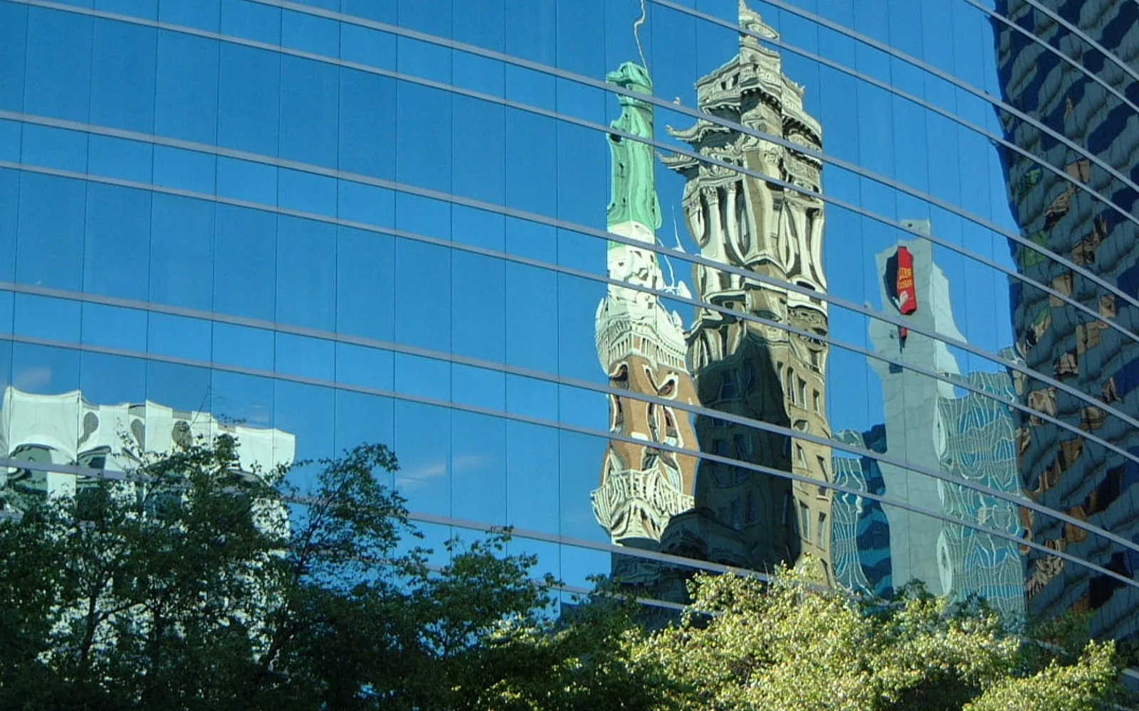 Modern downtown office buildings with reflective glass architecture showing technology sector development